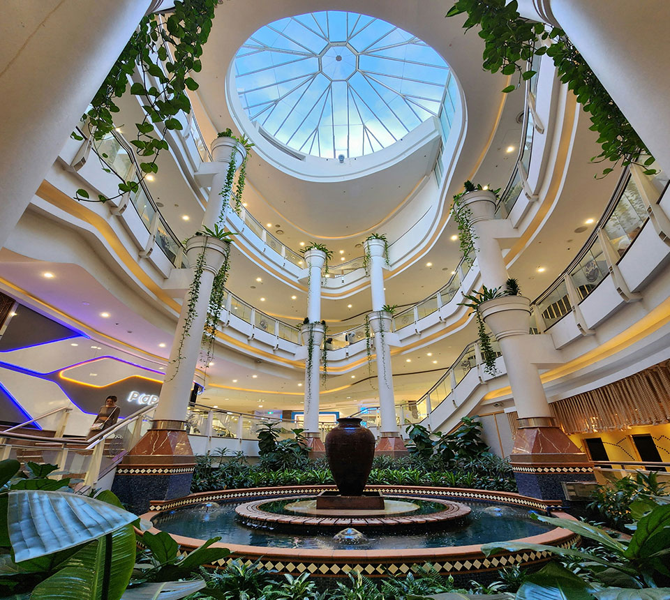 Hotel public atrium space designed for shared circulation and visual continuity across multiple levels