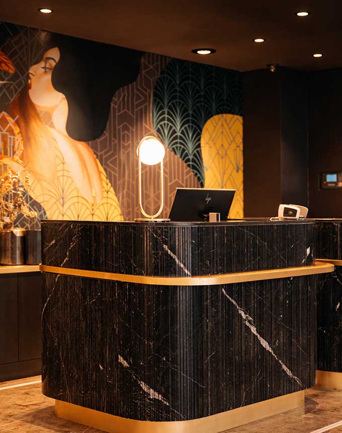 Large Format Artworks 2 large artwork behind hotel reception desk