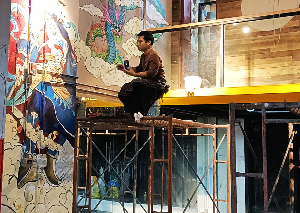 Wall Murals 4 artists working on large wall mural painting process studio production