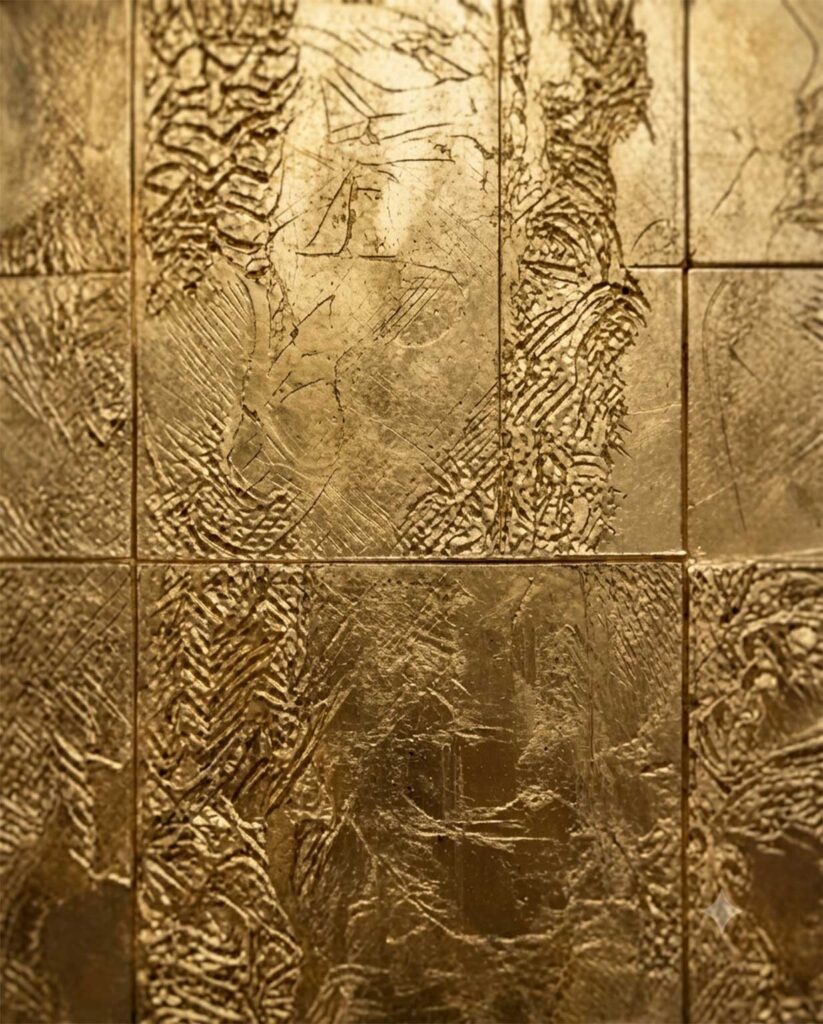 Texture Gilded Forms showcasing a luxury blue spiral sphere sculpture with gold accents on a marble counter in a fine dining restaurant lobby.