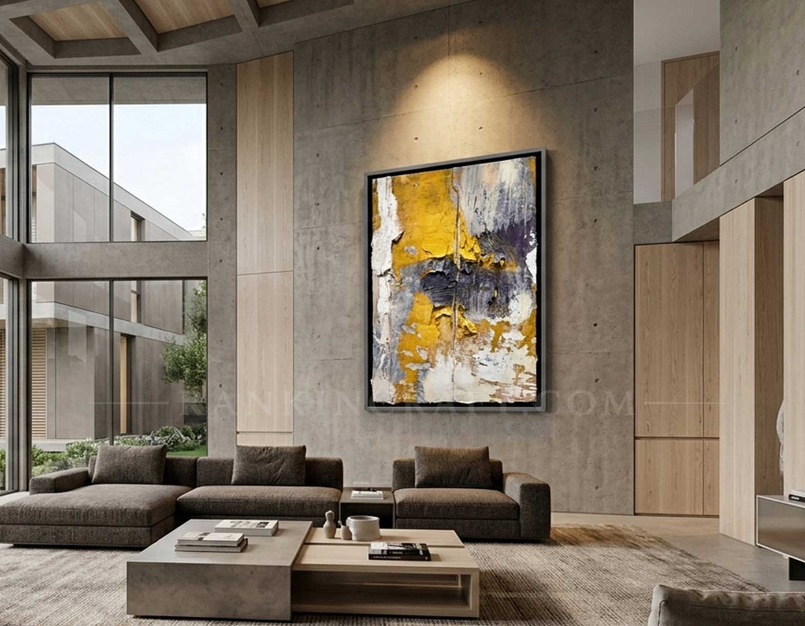 Framed abstract canvas wall art displayed in a modern luxury double-height living room interior